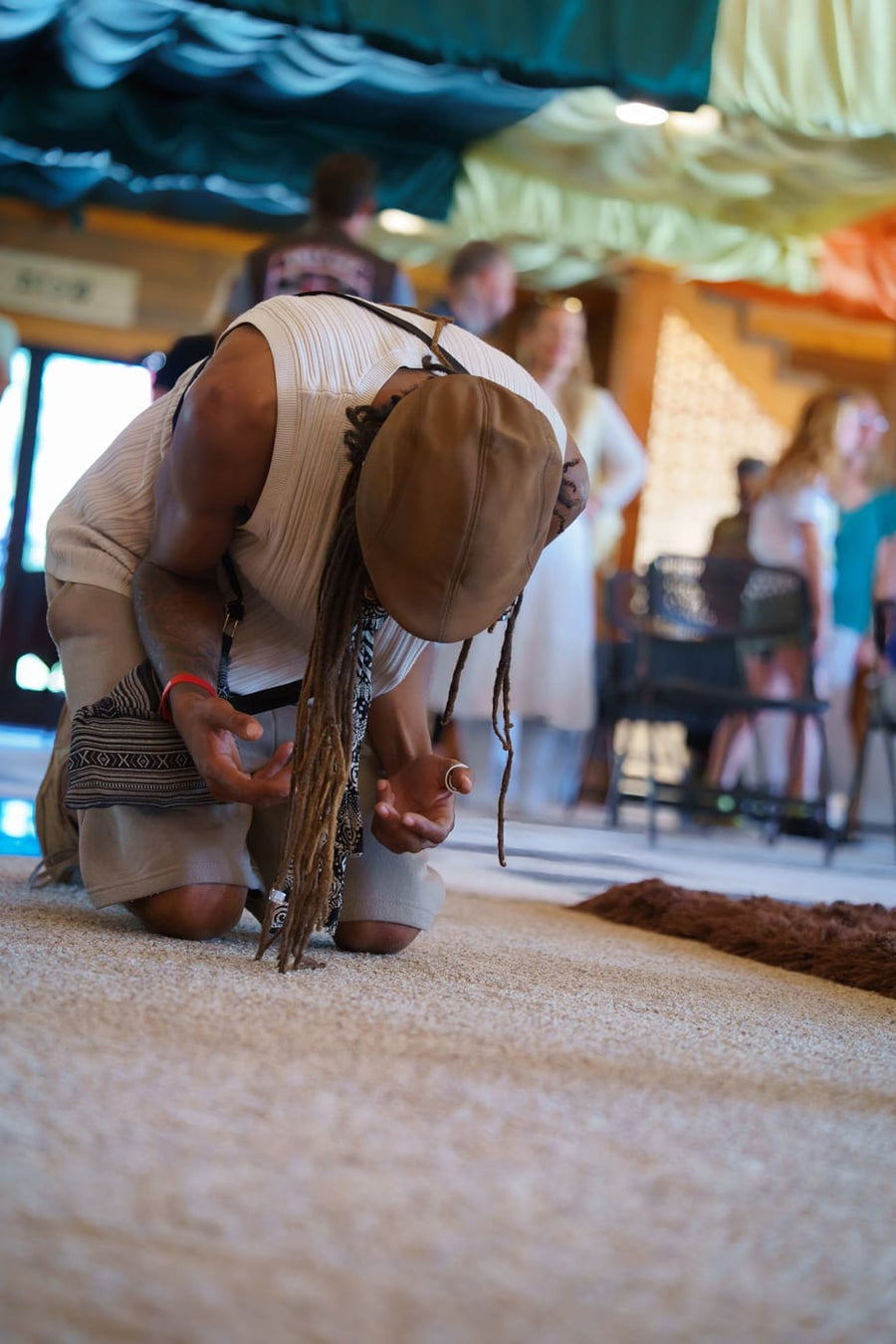 Bowed low on the carpet in worship