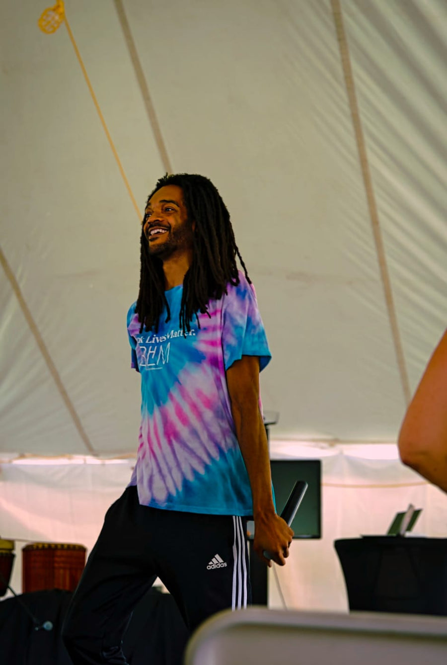 Laughing between verses under the tent