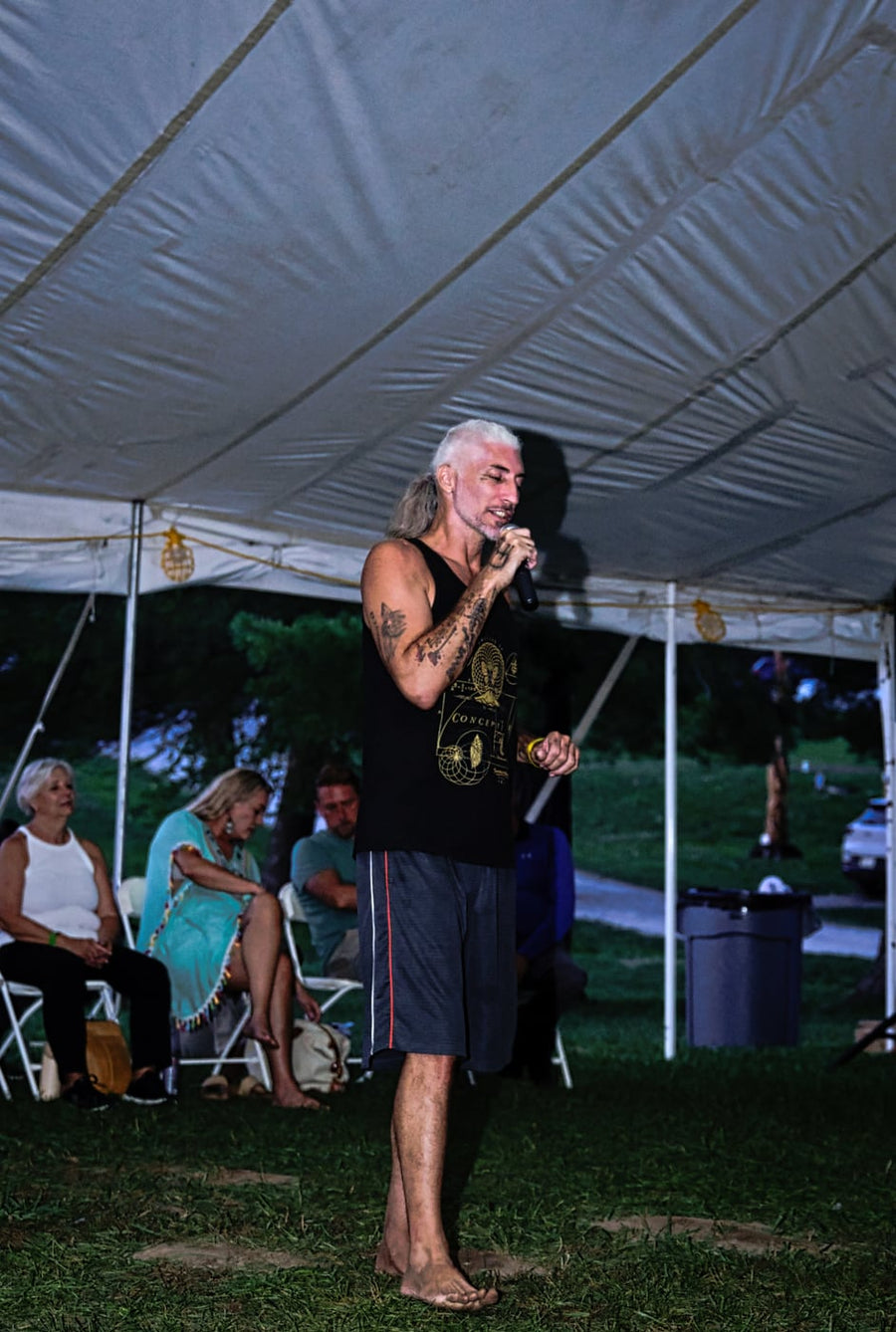 On the mic as the night settles