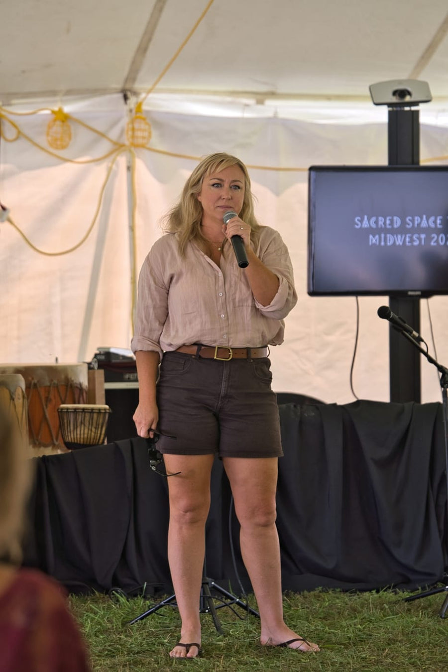 Telling her story to the tent
